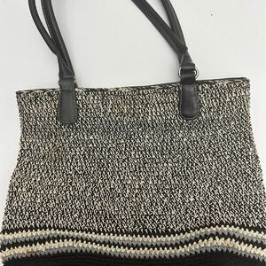Gray, beige and black women’s handbag